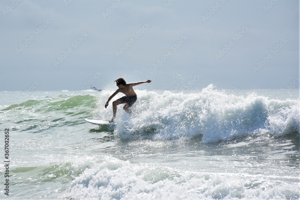 Surfer Surfing Waves