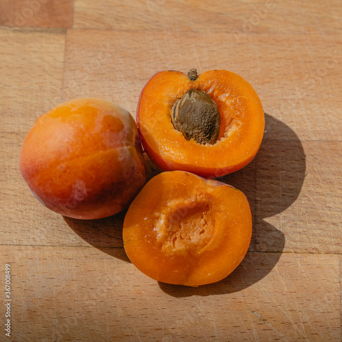 Fresh apricot on rustic, wooden table