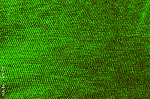 Bright green texture of fabric from a textile material for background