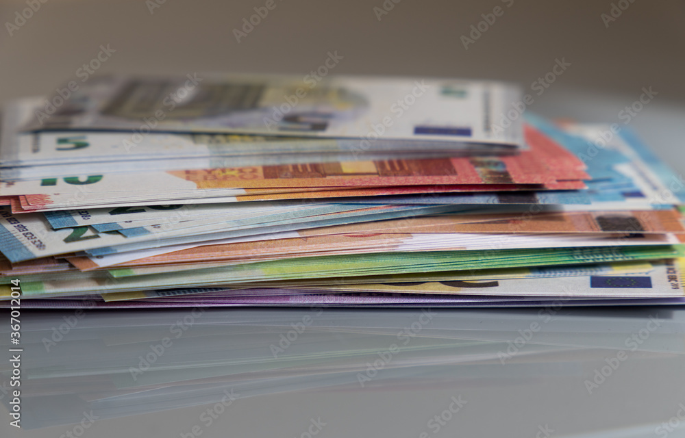 stack of euro banknotes on a desk
stack of euro banknotes on a desk