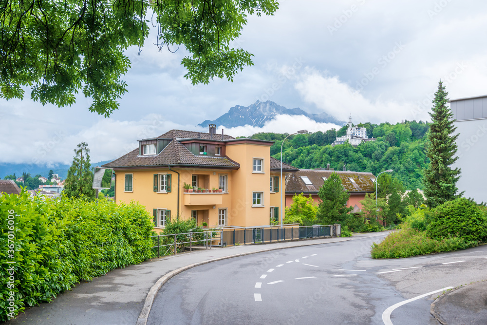 A perfect neighbourhood. Houses in suburb at Summer in Lucerne, Switzerland. Luxury houses with nice landscape. A perfect neighbourhood. Houses in suburb at Summer in Lucerne, Switzerland. Luxury houses with nice landscape.