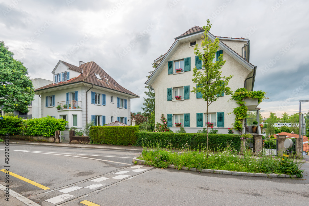 A perfect neighbourhood. Houses in suburb at Summer in Lucerne, Switzerland. Luxury houses with nice landscape.