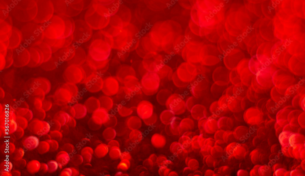 Red festive background for Valentine's Day. Abstract shimmering bright background with bokeh defocused red lights. Ruby wedding, New Year concept Red festive background for Valentine's Day. Abstract shimmering bright background with bokeh defocused red lights. Ruby wedding, New Year concept