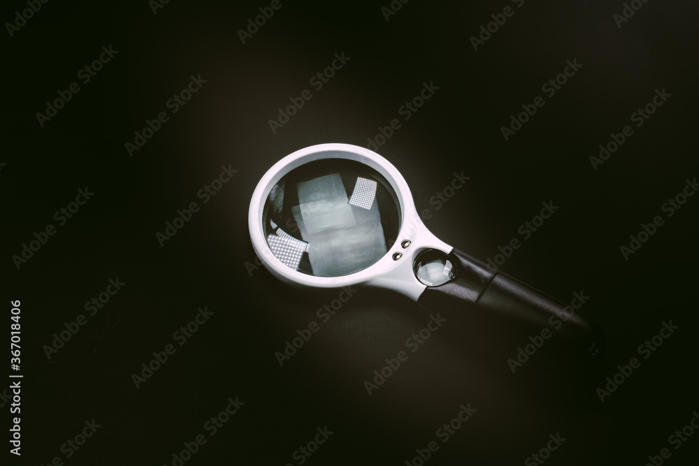 Magnifying glass on black background Magnifying glass on black background