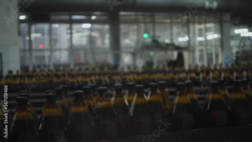 Beer Bottles On The Conveyor Belt. Selective Focus.
