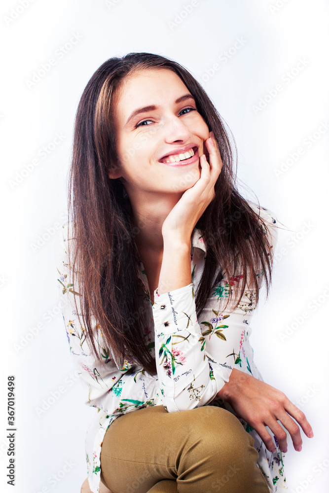 young pretty brunette girl hipster posing frendly against white background wall, smiling woman with long hair young pretty brunette girl hipster posing frendly against white background wall, smiling woman with long hair
