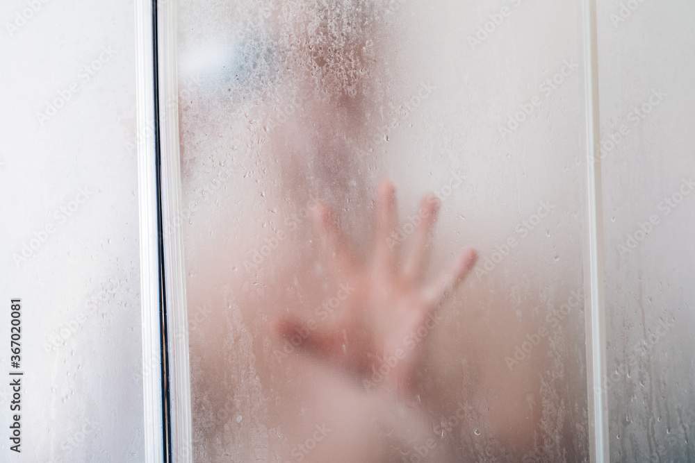Fototapeta premium Handsome muscular man at the shower.