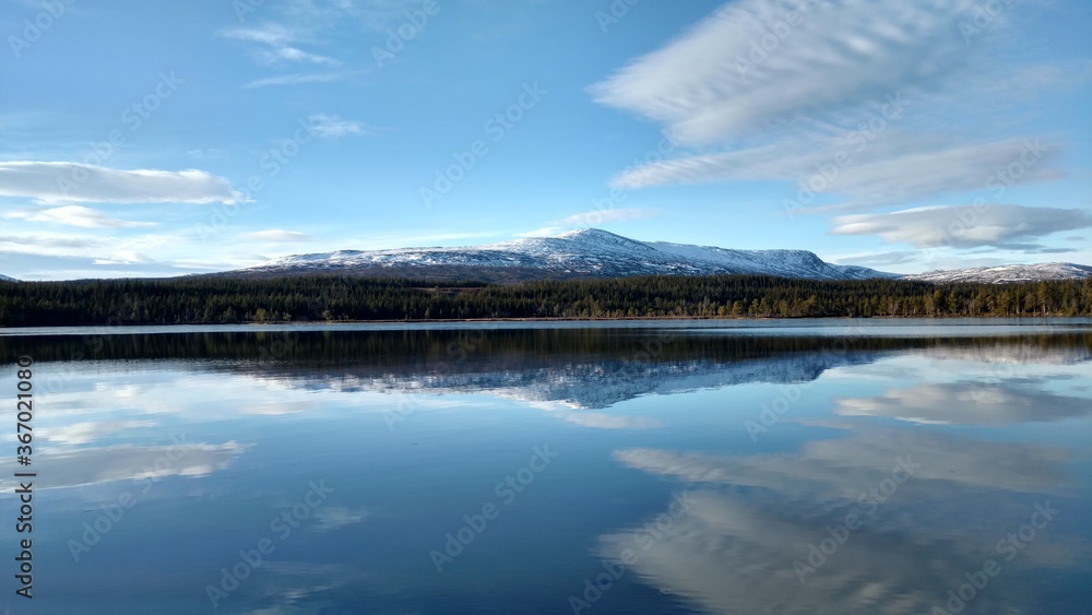 reflection of clouds in lake at mountain reflection of clouds in lake at mountain