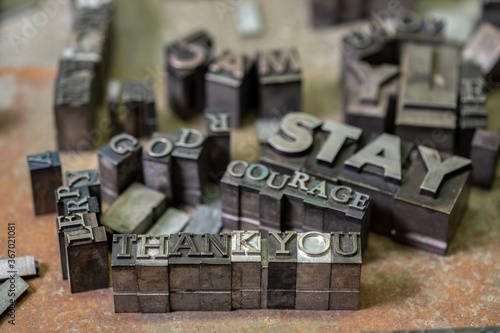 Antique letterpress type on table photo