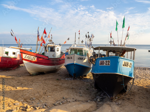 At Beach of Jaroslawiec in Poland fishing boats lie on the beach of the Baltic Sea photo