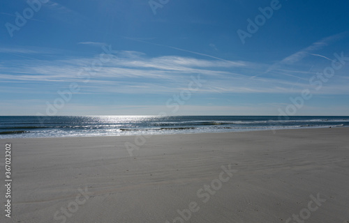 Sun Reflecting Off Calm Atlantic Ocean at Low Tide