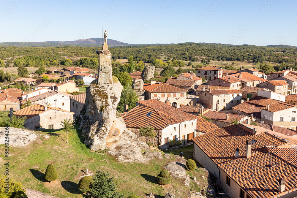 a view over Hacinas town and the Statue of Christ on top of a boulder, province of Burgos, Castile and Leon, Spain