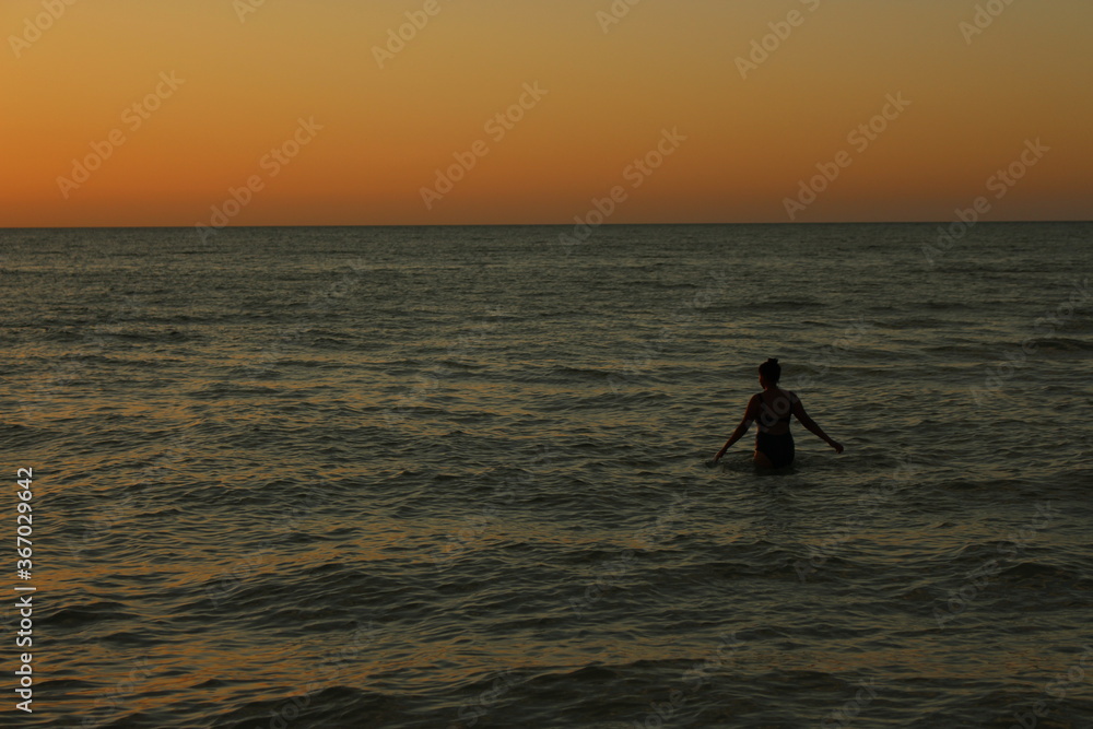 Lonely woman at the sea