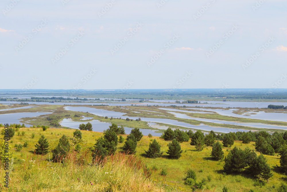 Nice view from the hill to a large wide river. Background. Landscape. Panorama.