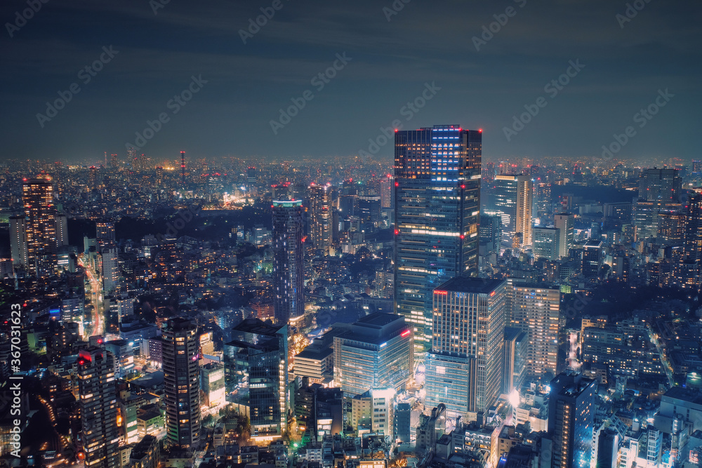 Tokyo, Japan - February 3, 2018: Modern cityscape building aerial view at night, capital city of Japan, business city concept image, shot in Roppongi Hills of Minato Ward, Tokyo, Japan.