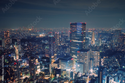 Tokyo, Japan - February 3, 2018: Modern cityscape building aerial view at night, capital city of Japan, business city concept image, shot in Roppongi Hills of Minato Ward, Tokyo, Japan.