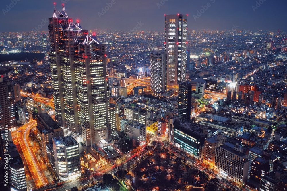 Tokyo, Japan Night View - Business city concept image, modern cityscape building in evening, Shot in Shinjuku Ward, Tokyo, Japan.