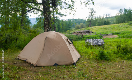 closeup touristic tent on a forest glade  travel scene