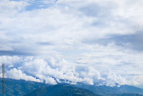 mountain ridge silhouette in a mist and dense clouds, outdoor natural background