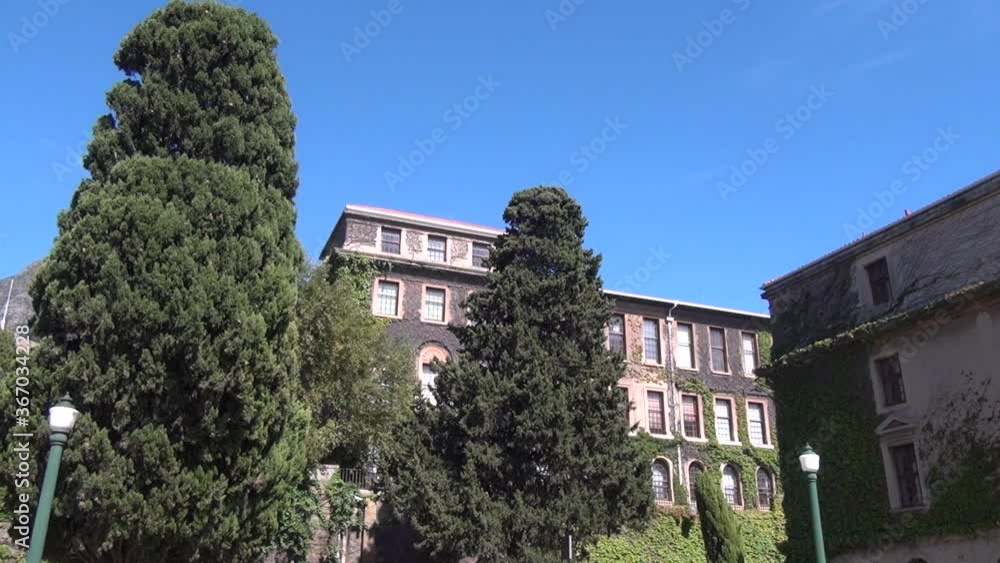 HD sunny day video of spectacular University of Cape Town, its sport grounds, green trees, old buildings and shady alleys in Western Cape, Cape Town, South Africa HD sunny day video of spectacular University of Cape Town, its sport grounds, green trees, old buildings and shady alleys in Western Cape, Cape Town, South Africa