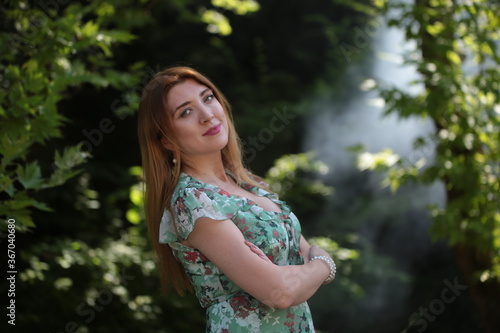 woman in green dress on nature 