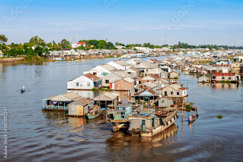 Bild auf Leinwand Rafting and aquaculture village on Chau Doc river, Vietnam.