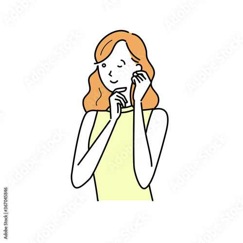 ピアスをつける女性