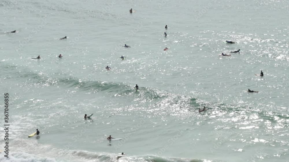 Aerial view of surfers in the sea. Drone Footage Aerial view of surfers in the sea. Drone Footage