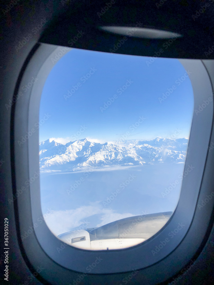view of Himalayas from airplane window view of Himalayas from airplane window
