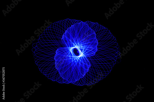 Wonderful and abstract circular and parabolic patterns drawed various light trails with LED ball lights on a dark back ground Pendulum. 