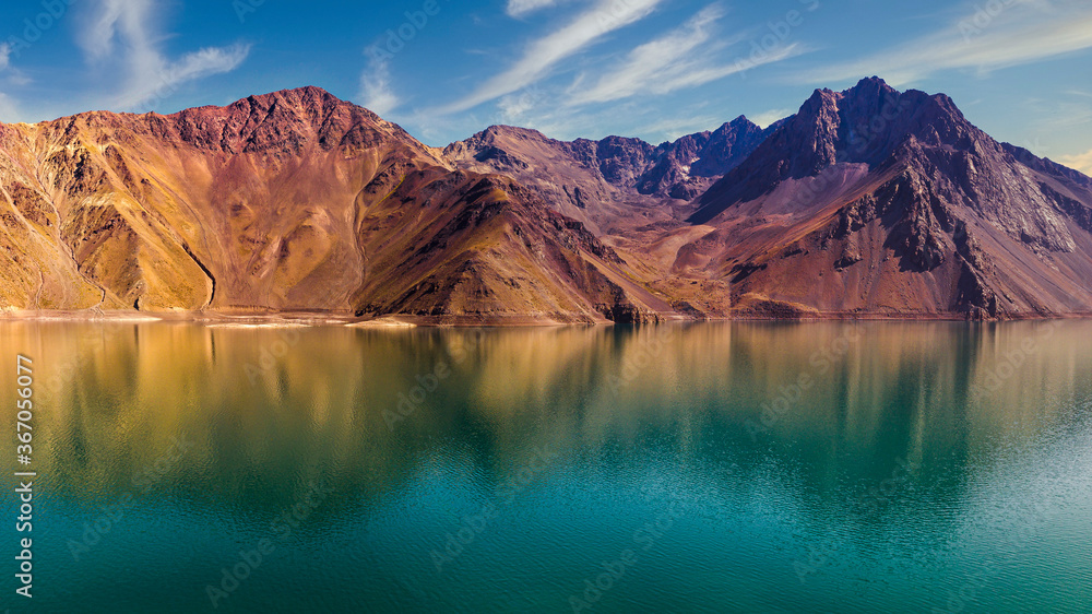 colourful, warm mountains reflected in the lake