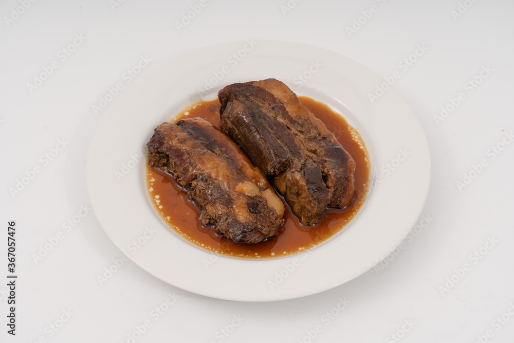 braised pork belly in a sweet soy sauce Japanese styles on white background. braised pork belly in a sweet soy sauce Japanese styles on white background.