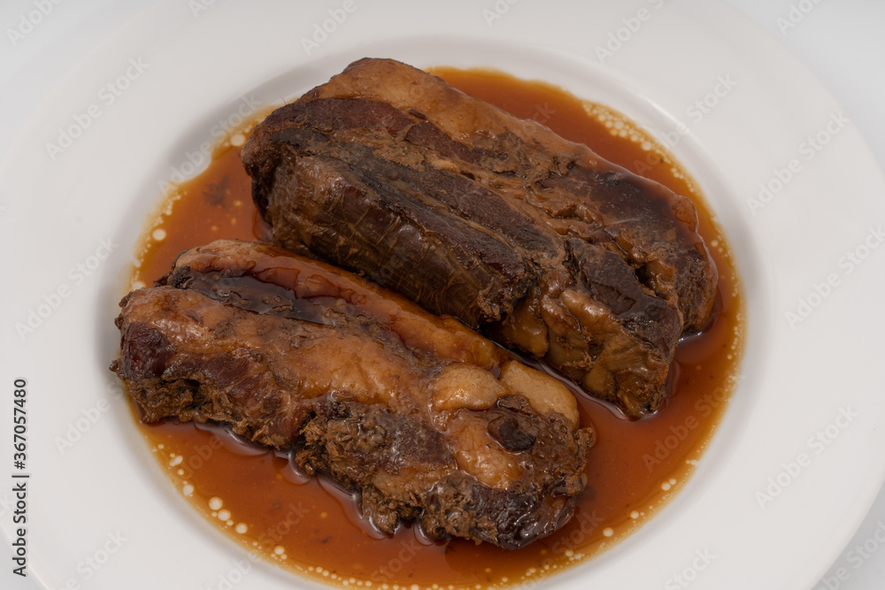 braised pork belly in a sweet soy sauce Japanese styles on white background. braised pork belly in a sweet soy sauce Japanese styles on white background.