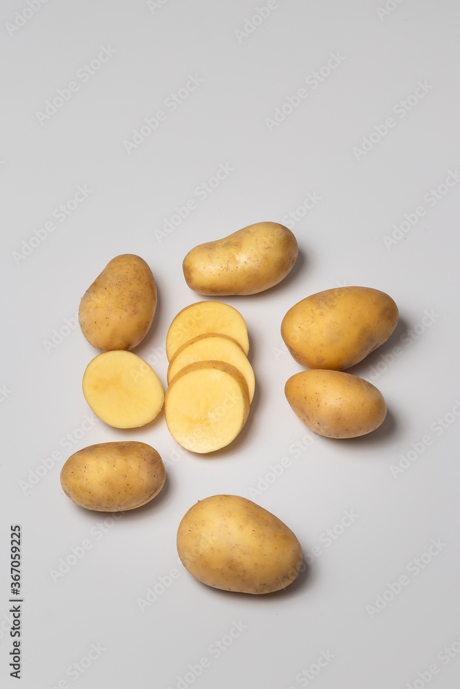 Potato with a Chopped potato on a white background Potato with a Chopped potato on a white background
