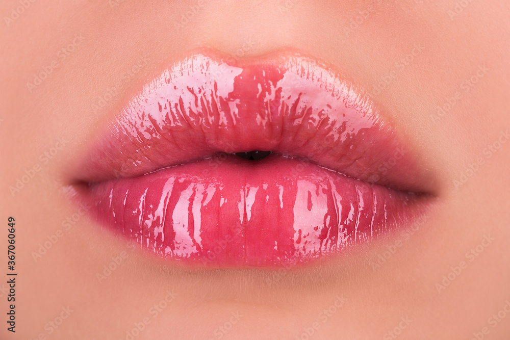 Sexy female lips with pink lipstick. Sensual womens open mouths. Red lip with glossy lipgloss. Seductive lips of a young woman. - obrazy, fototapety, plakaty 