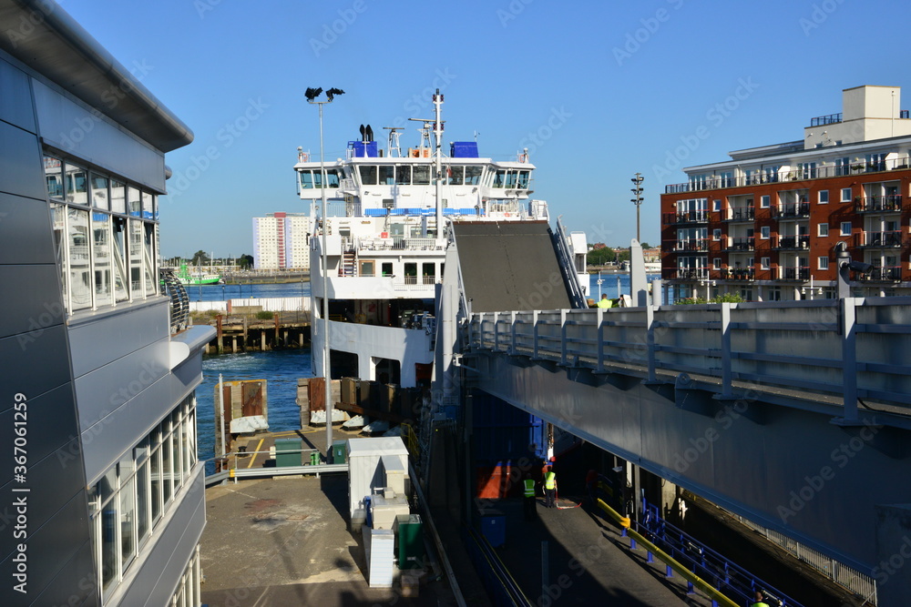Car ferry docking at Portsmouth Harbour. Stock Photo Adobe Stock