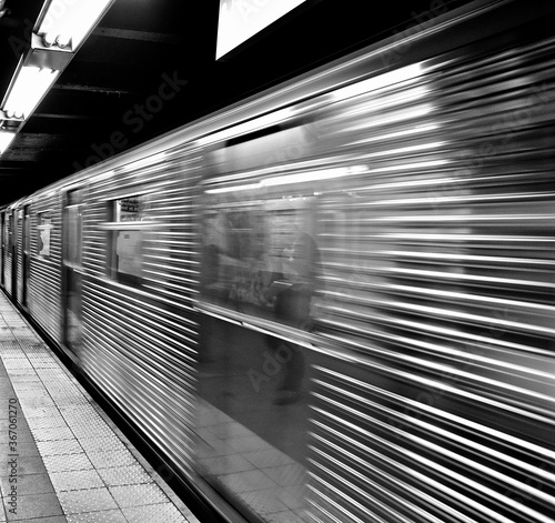 NYC subway station train in motion Black and white