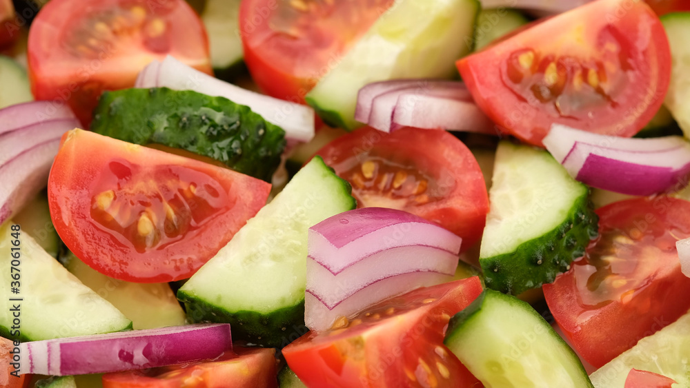 vegetables salad with tomatoes, cucumber, red onion close up vegetables salad with tomatoes, cucumber, red onion close up
