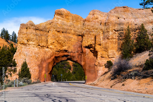 Stone arch tunneled for a road in Red Canyon