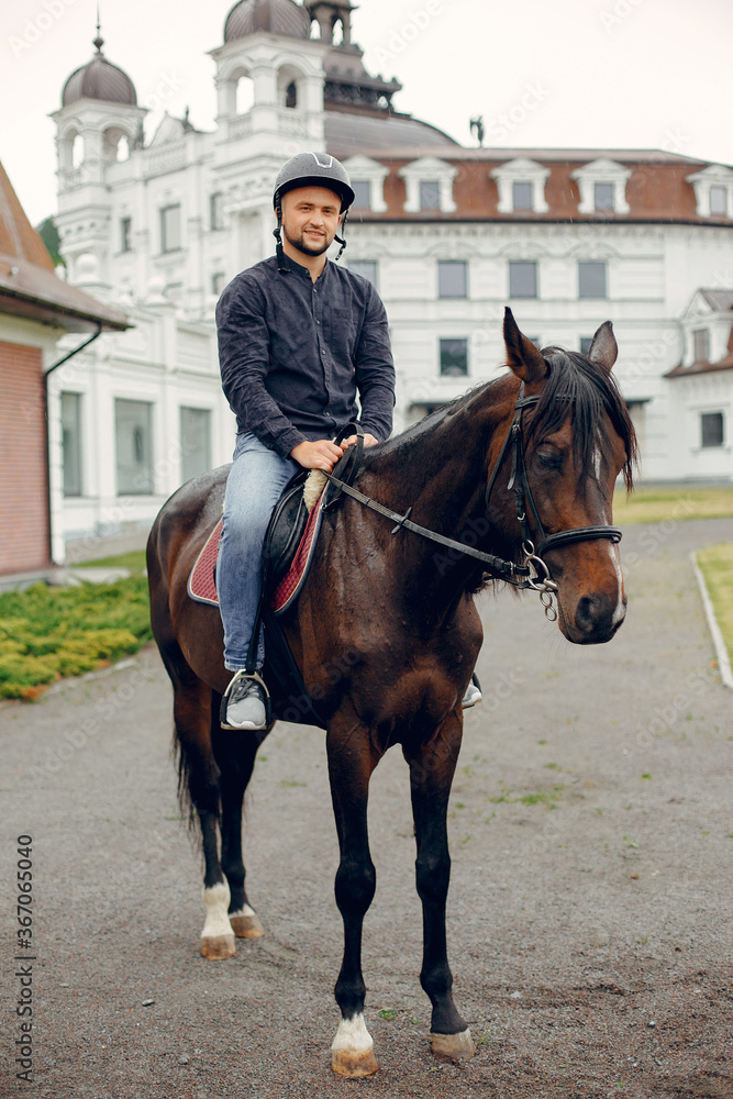 Horse theme. Businessman with a horse. Man in a black shirt Horse theme. Businessman with a horse. Man in a black shirt