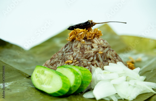 The famous Thailand crusine rice warp by banana leaf call Khao Kan Jin photo