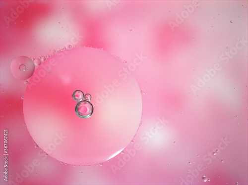 abstract background with pink bubbles oil ,macro image ,blurred sweet color for card design ,bright wallpaper, shiny water droplets