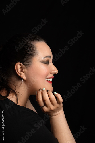 natural photo of a woman with a natural smile on a black background