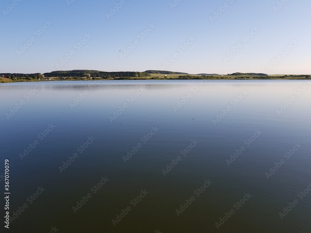 The calm surface of the water in the lake