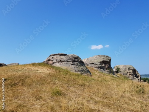 Stone granite rock in the steppe