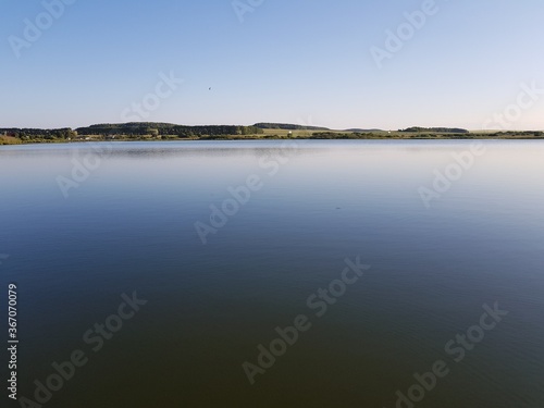 The calm surface of the water in the lake