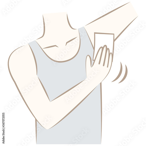 汗対策やボディケアで脇の下を拭く男性