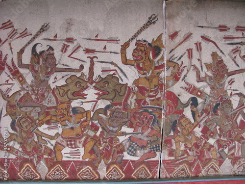Kertha Gosa Pavilion has the story of the Balinese Journey of the Soul painted around the ceiling, it shows a depiction of people being tortured for their sins. photo