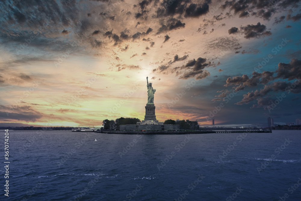New York Statue Of Liberty at sunset, view from river
