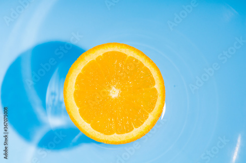 Cool splash orange slice in summer